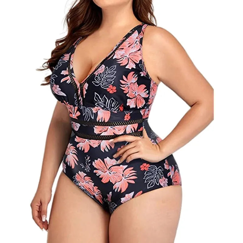 Black printed plus size women's bikini swimsuit with mesh stitching, shown on a model.