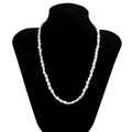 White U-shaped imitation pearl men's necklace with a shellfish pendant on a model.