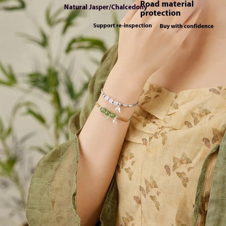 Women's Hetian Jade bracelet with diamond chalcedony and lotus charm on woven strap in light green or haze blue