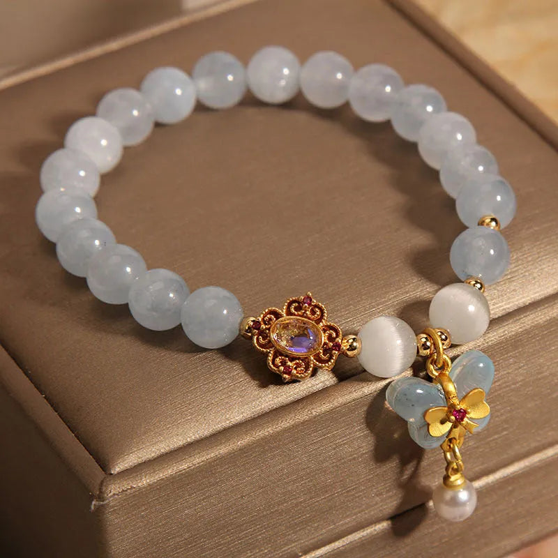 Crystal bracelet with aquamarine butterfly pendant and rhinestone details for women