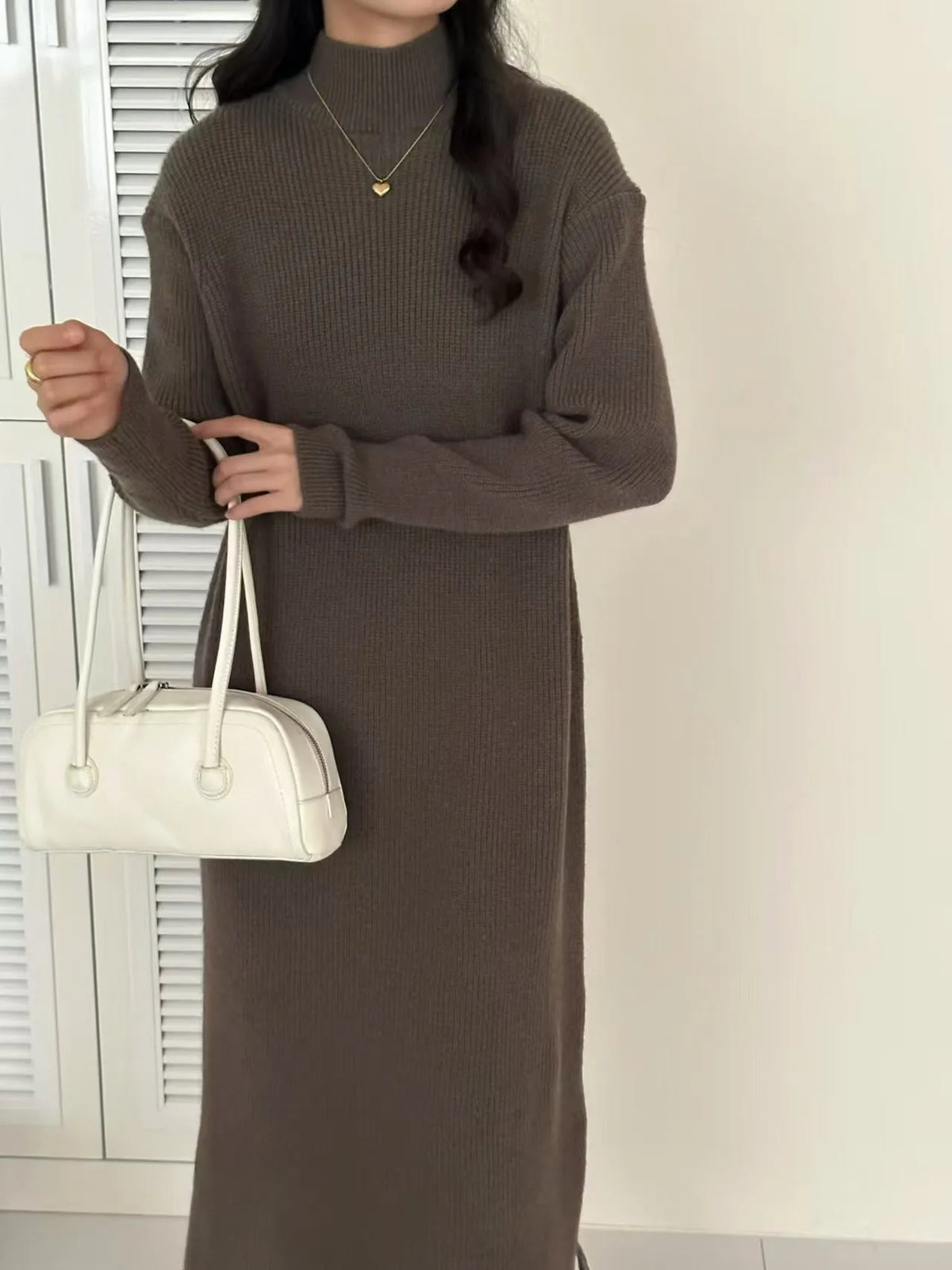 Women's acrylic knitted dress with half turtleneck, long sleeves, and midi length in solid colour