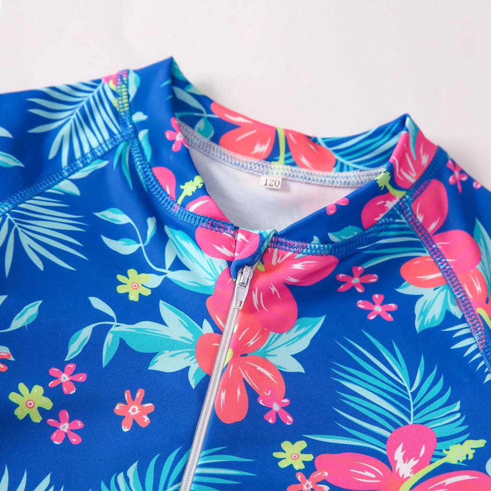 Girl's long-sleeve one-piece swimming suit in a bright colour, showing the full briefs-style design.