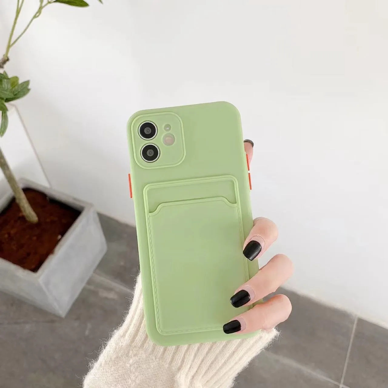 Orange TPU phone case with card slot back cover for iPhone showing protective edge