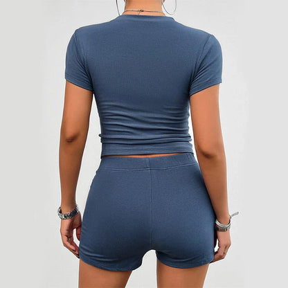 Sleek and stylish women's sports outfit featuring a short-sleeved top and elastic shorts in a variety of trendy colors