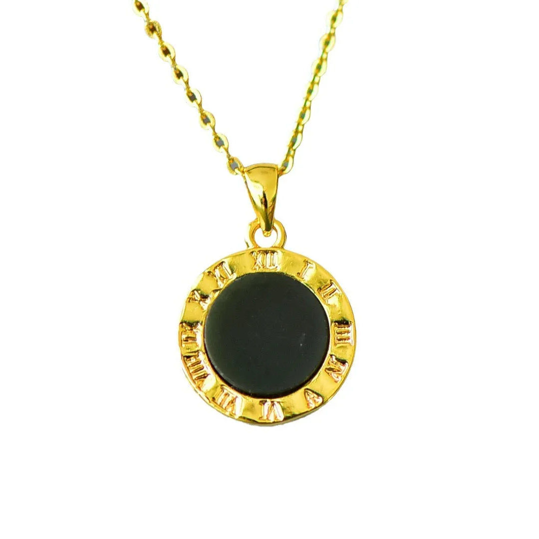 Flat Hetian jade pendant necklace with copper inlay on a gray background.