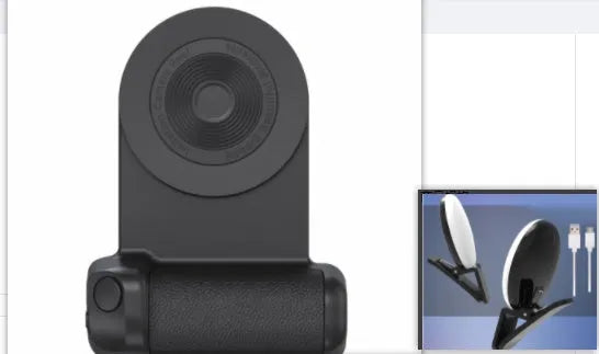 Black magnetic phone camera holder with rotatable grip on wooden table demonstrating phone attachment