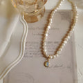Vintage pearl necklace with geometric pendant on adjustable chain up to 50cm.