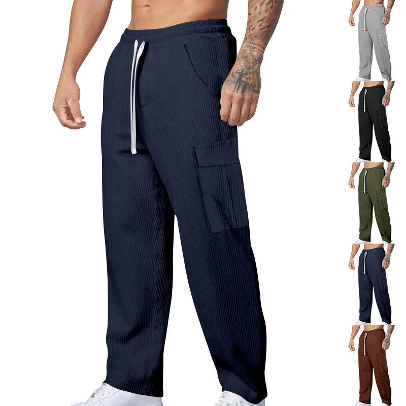 Men's corduroy cargo trousers in navy blue with straight-leg wide-cut design and drawstring waist