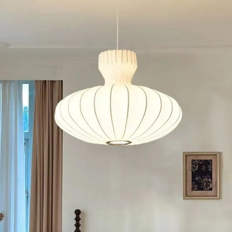 Vintage-style silk chandelier with a Chinese design, shown with its variable three-colour light effect.