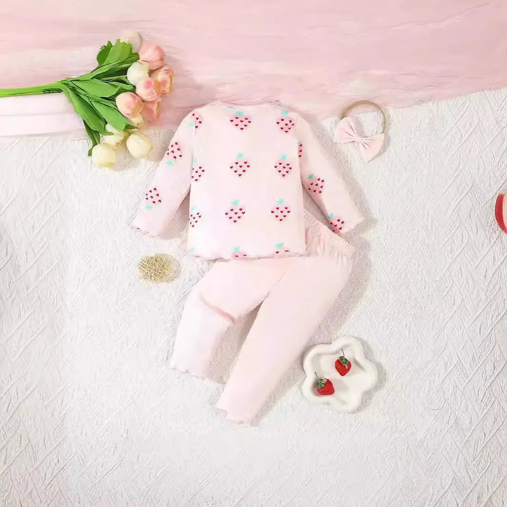 Infant wearing a printed long-sleeve top, solid trousers, and matching cap from the 3-piece suit set.