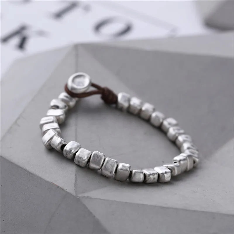 Women's handmade silver bracelet with wooden irregular square design on elasticated band