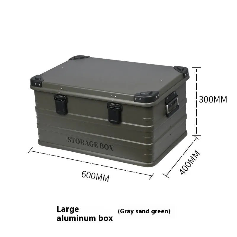Army green waterproof storage box mounted in a vehicle cargo area.