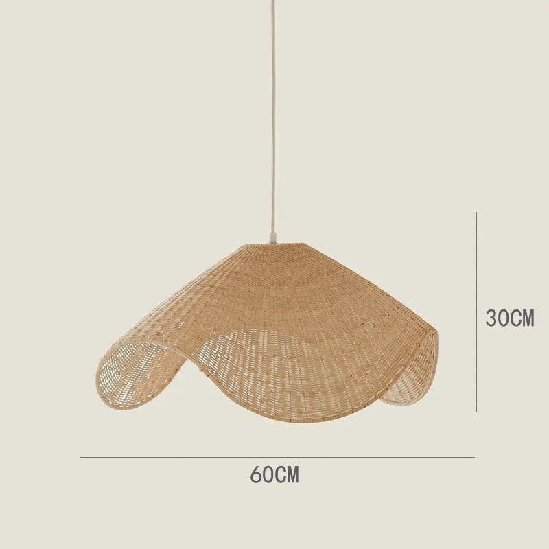 Handmade natural bamboo rattan pendant light chandelier with a woven lampshade emitting a warm glow.