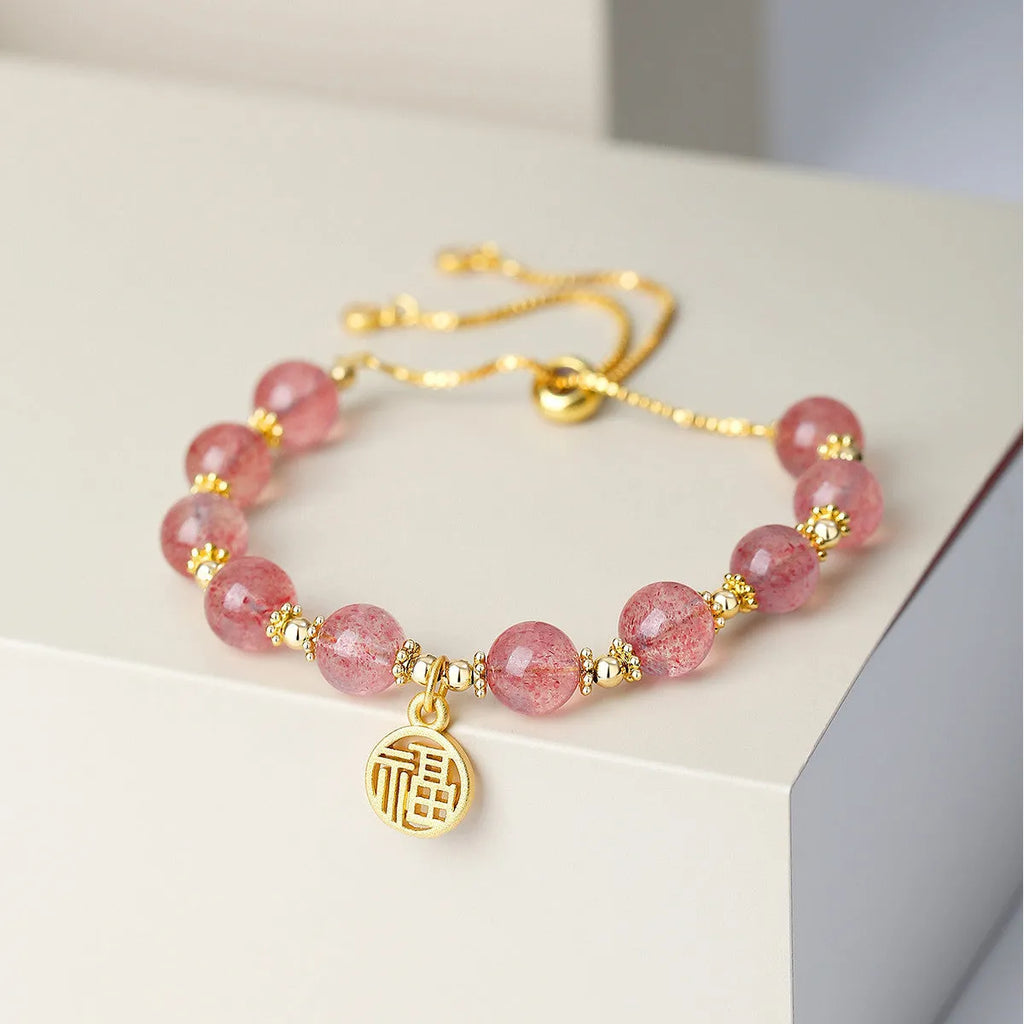Women's Strawberry Quartz crystal bracelet with geometric design and Fu character, electroplated metallic finish