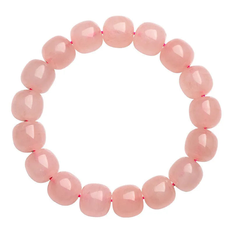 Natural pink crystal barrel bead bracelet with geometric design on wrist