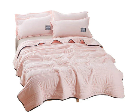 Lightweight, breathable cooling comforter in various colors and sizes for comfortable summer sleep