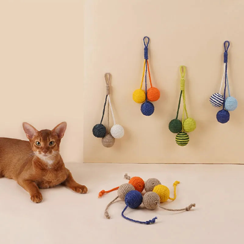 Four-piece cat toy set showing teaser stick and coloured, bite-resistant catnip balls.