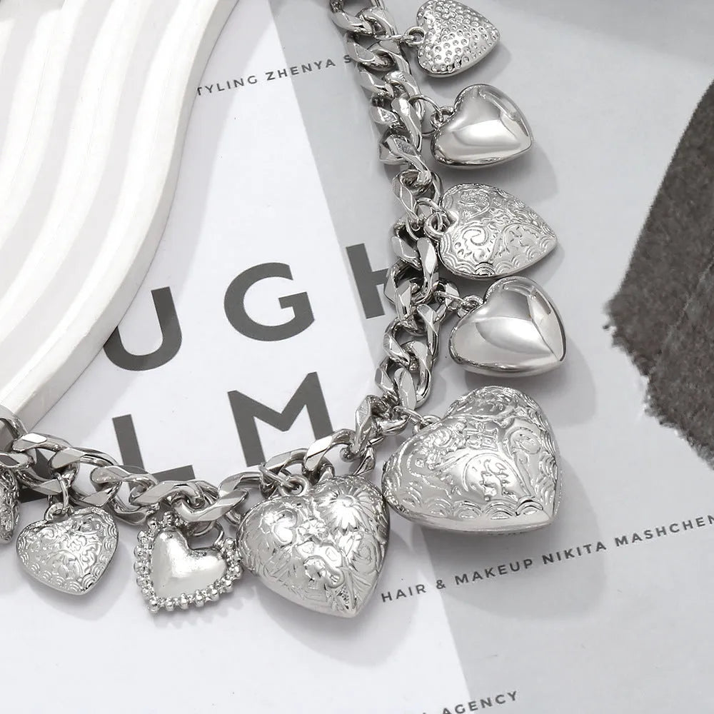Carved heart pendant necklace in alloy metal with adjustable chain length between 41cm and 50cm