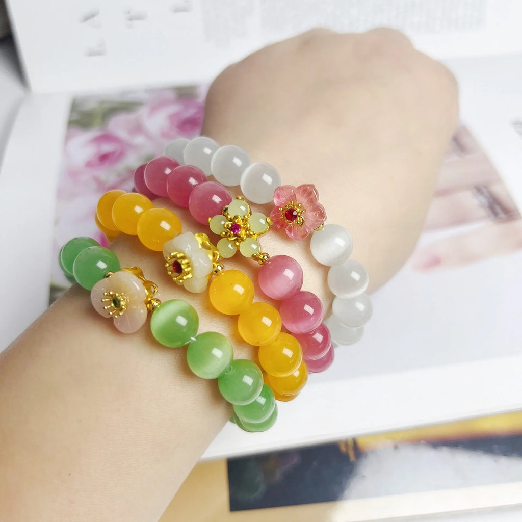 Women's handmade glass bead bracelet with floral design in green, pink, white or yellow