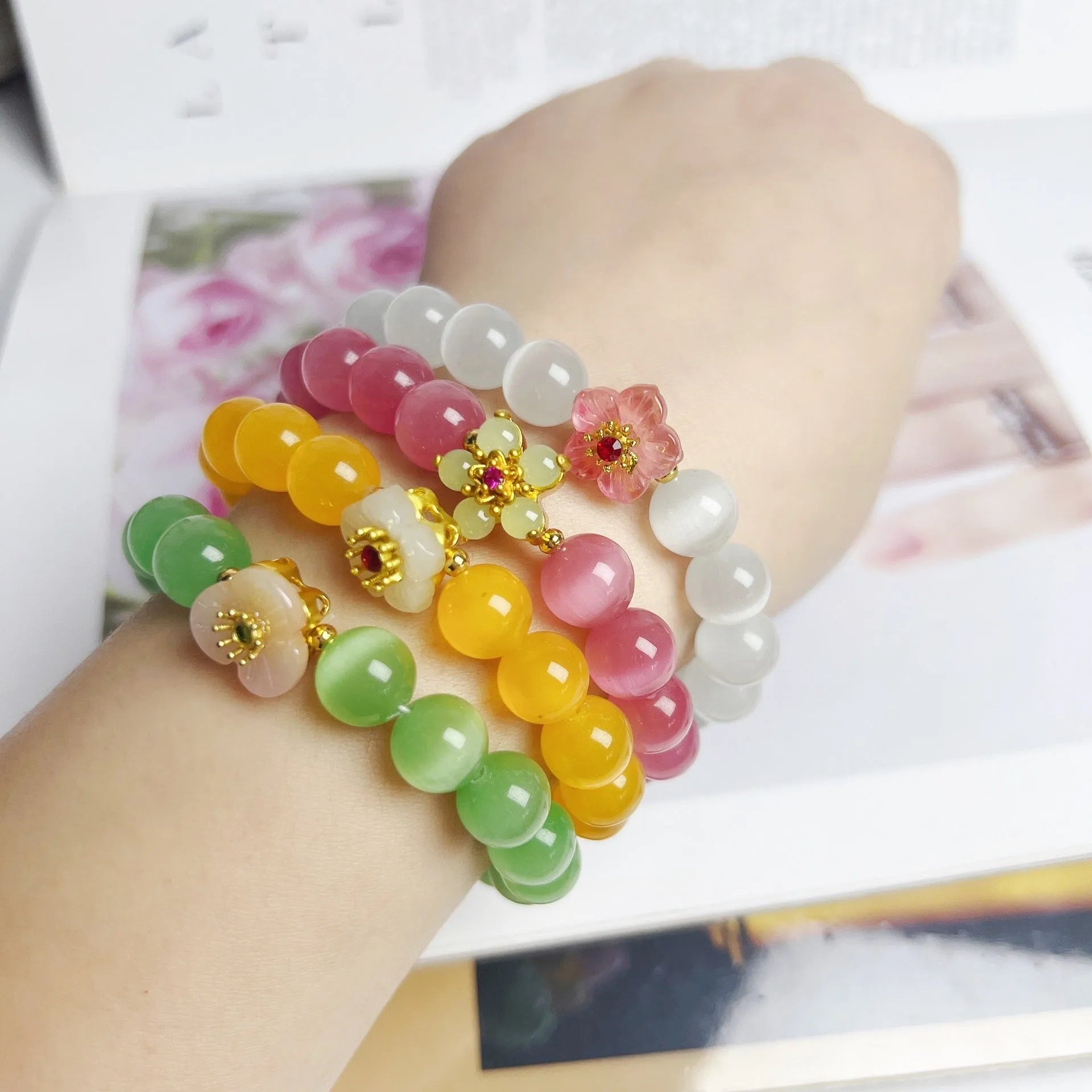 Women's handmade glass bead bracelet with floral design in green, pink, white or yellow