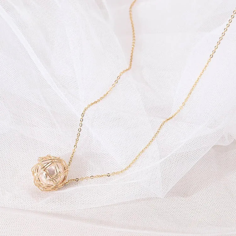 Gold minimalist pendant necklace with hollow ball and imitation pearl on twist chain 78cm