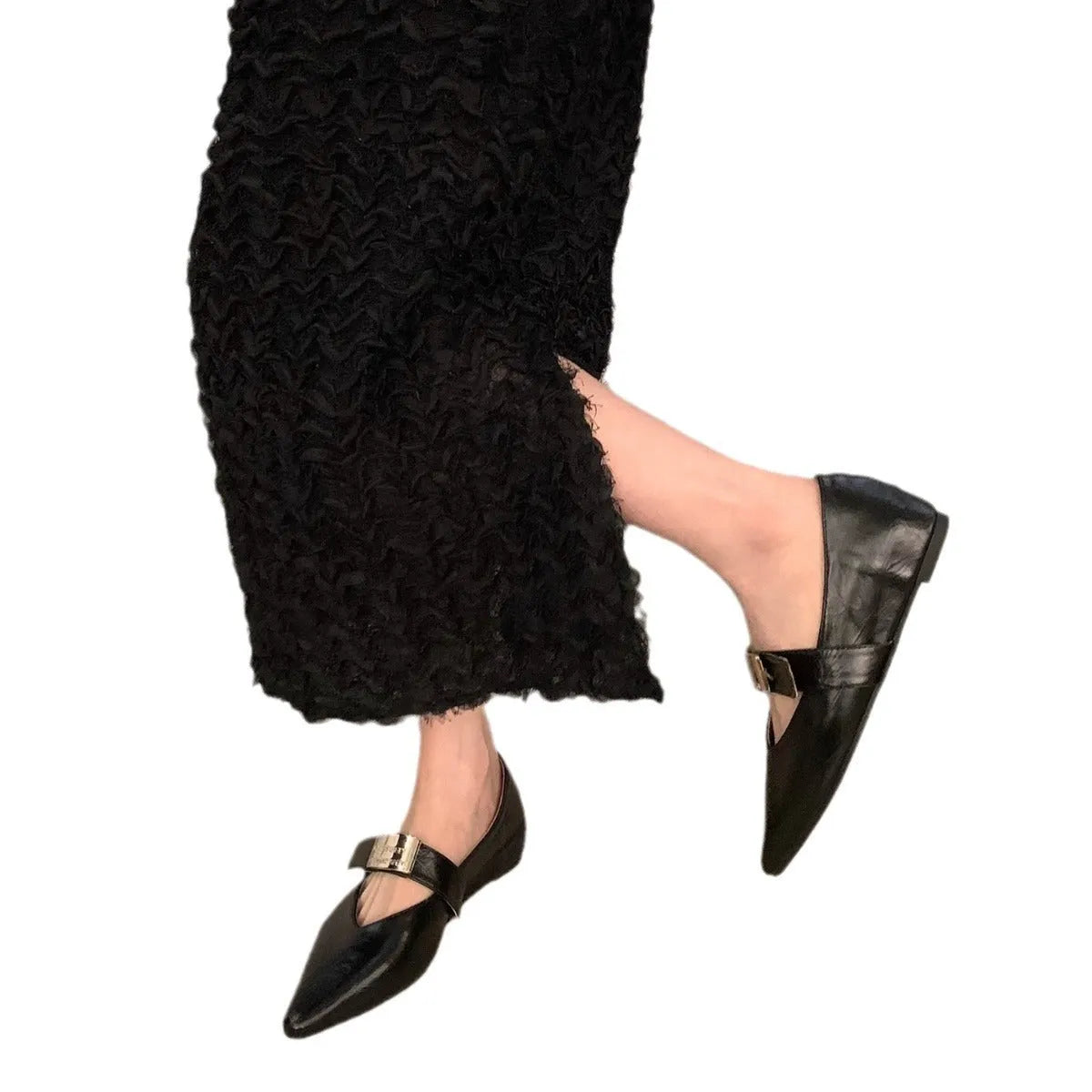 Women's black Mary Jane shoes with pointed toe, silver buckle, and low heel
