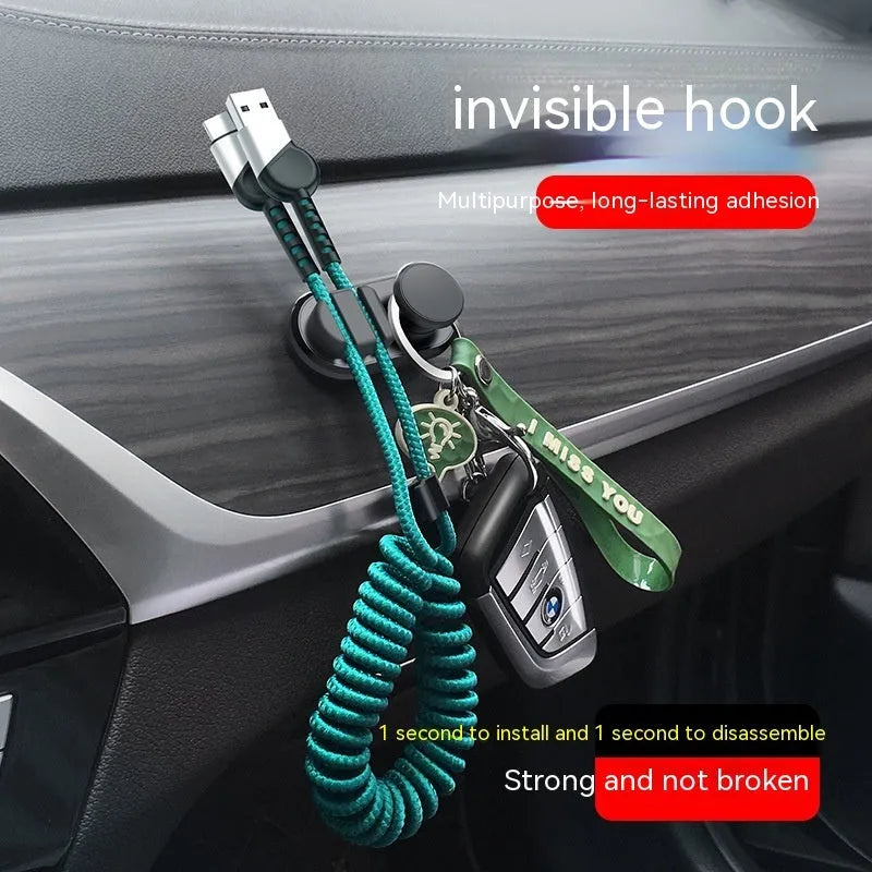 Compact dark green ABS silicone data cable storage hook for car or home use.