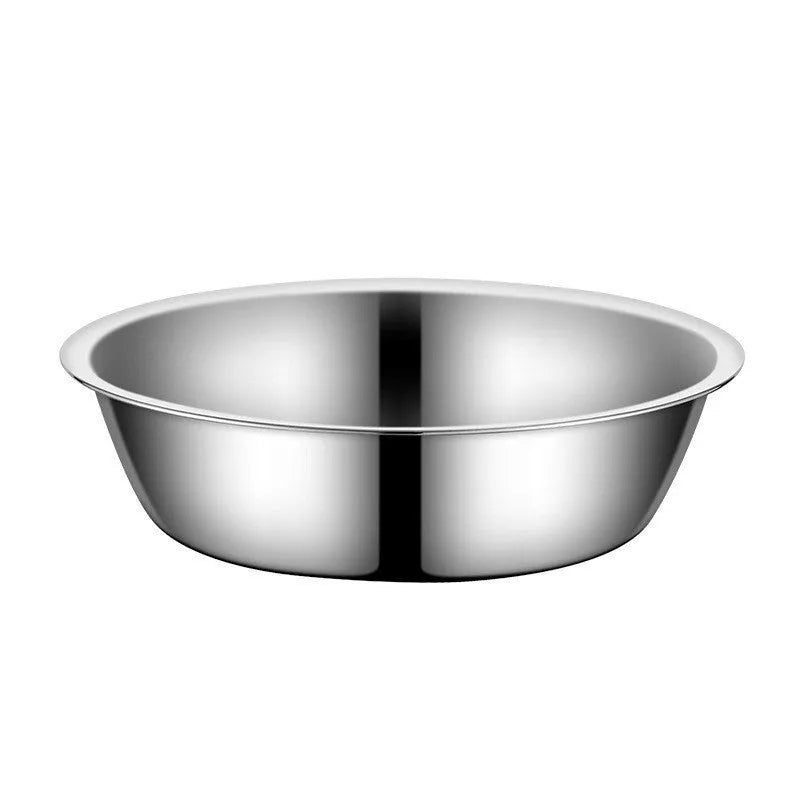 Stainless steel pet food bowl with non-slip base on a kitchen floor
