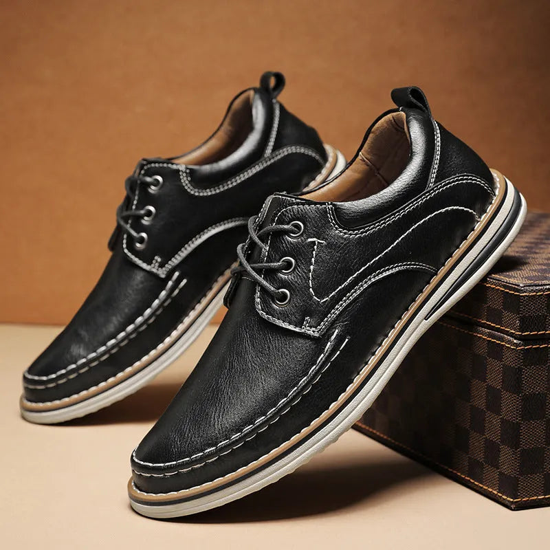 Men's black genuine leather lace-up casual shoes with round toe and low rubber sole on a white background.
