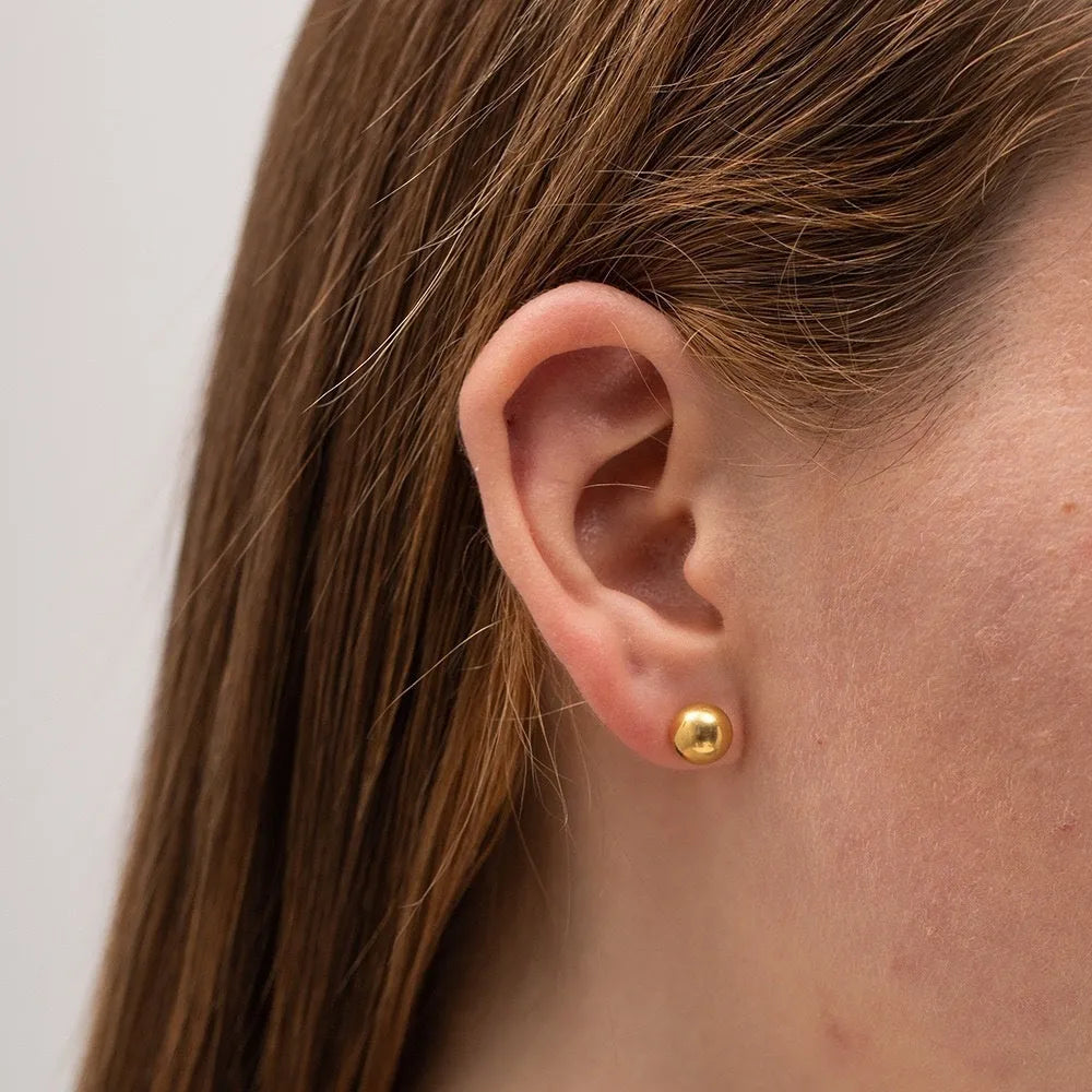 Stainless steel ball stud earrings with geometric round design in gold and silver finishes