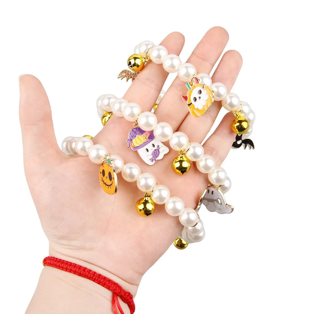 Halloween cat collar with simulated pearl necklace and pumpkin designs including purple ghost, skull, and smiling patterns