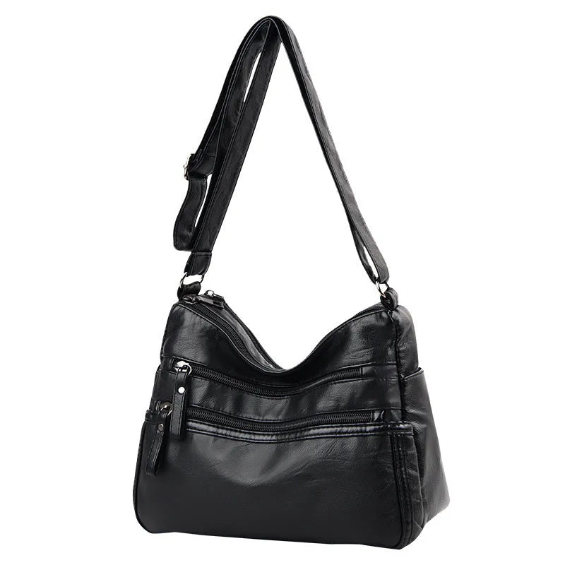 Real washed leather crossbody bag in solid colour with soft handle and slit pocket