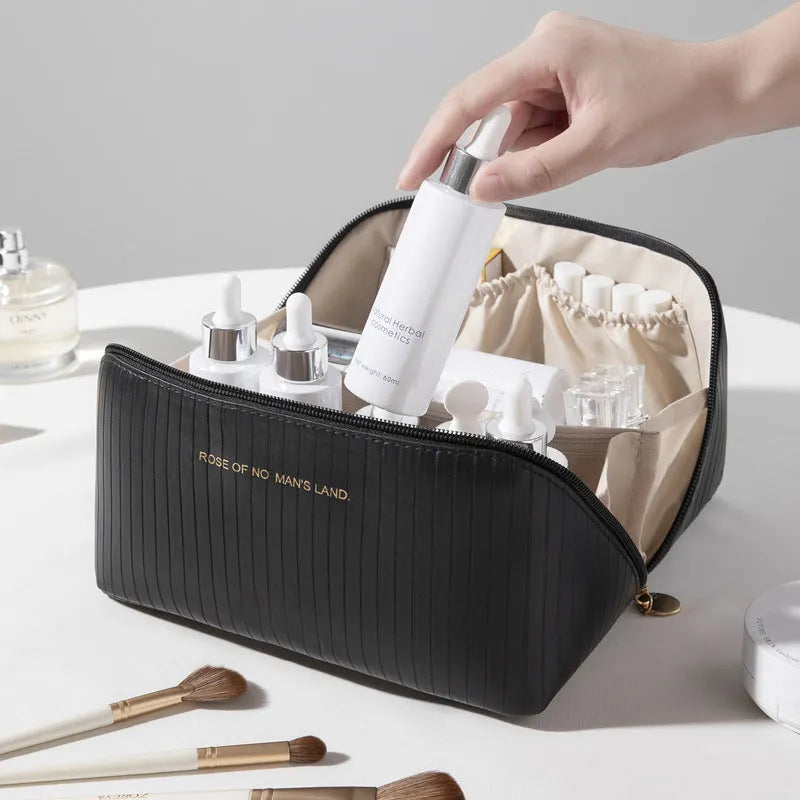 Vertical pattern pillow makeup bag in PU material measuring 22.5cm cubic for travel storage