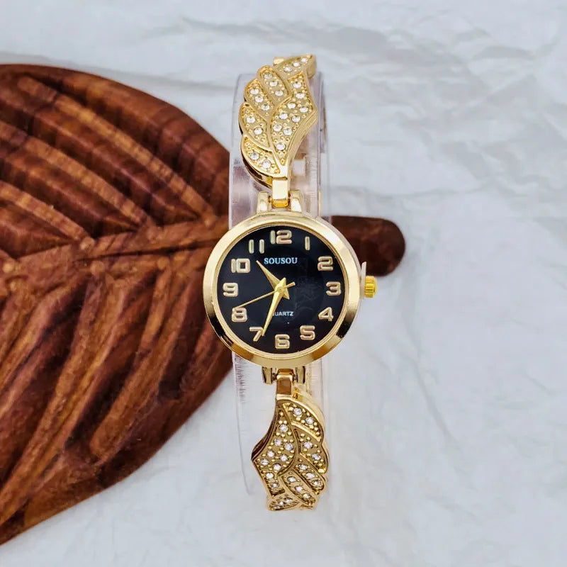 Women's stainless steel watch with a round dial shown in gold, golden white, and black/gold surface options.
