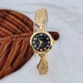 Women's stainless steel watch with a round dial shown in gold, golden white, and black/gold surface options.