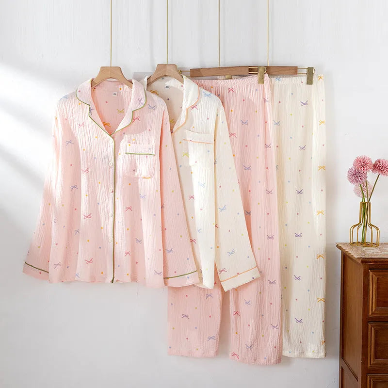 Women's beige cotton long-sleeved pajamas top and trousers set laid flat