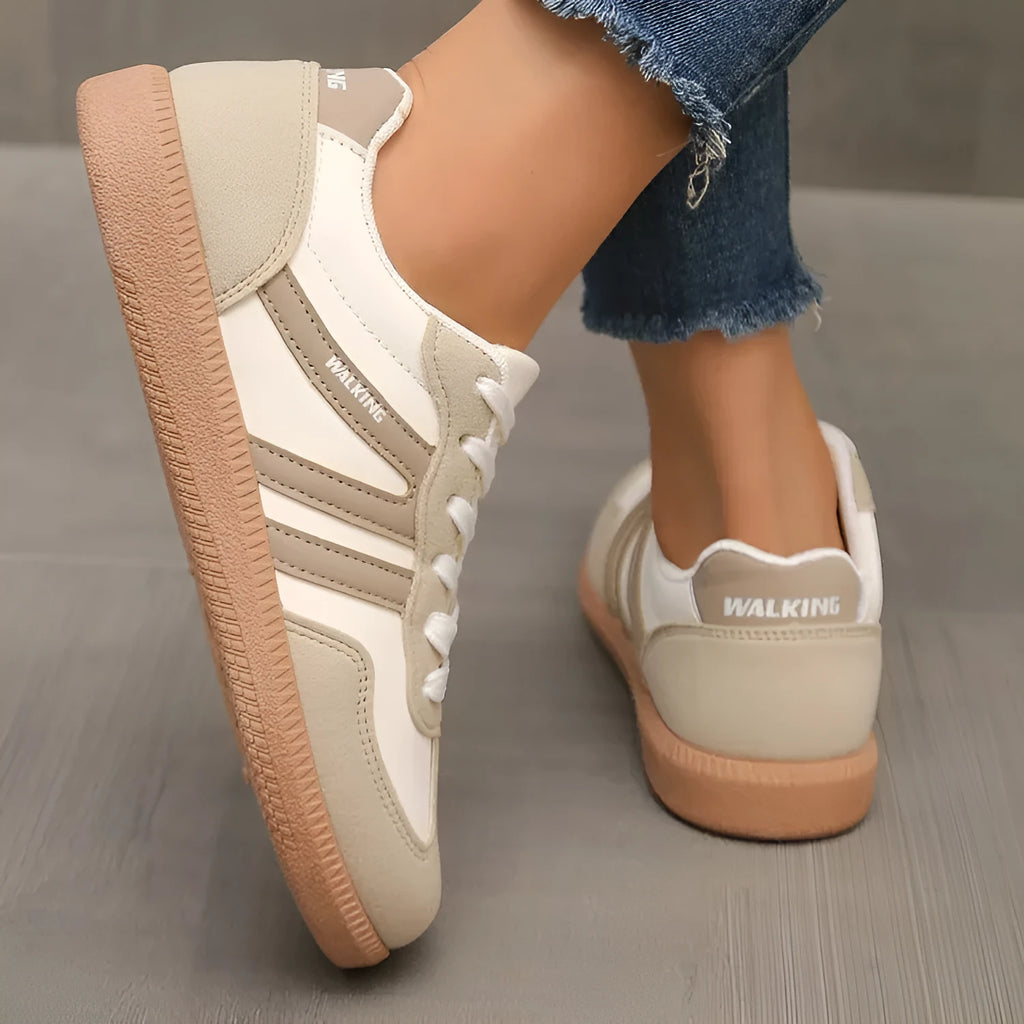 Plus size low-top sneaker in artificial PU with flat rubber sole and lace-up front, shown in multiple colour options.