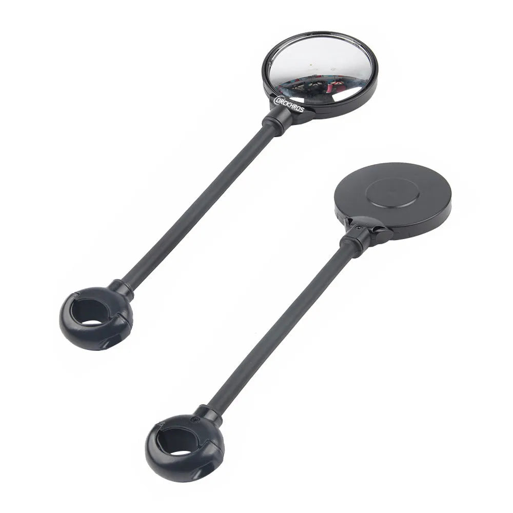 Black metal bicycle rearview mirror with hose adjustment clamp attached to handlebar