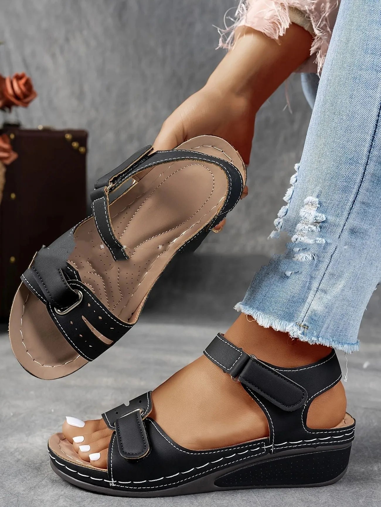 Women's beige plus size sandals with a thick composite sole and an adjustable Velcro strap fastener.