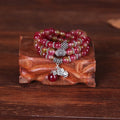 Handmade natural watermelon crystal Chinese knot bracelet in geometric elephant style.