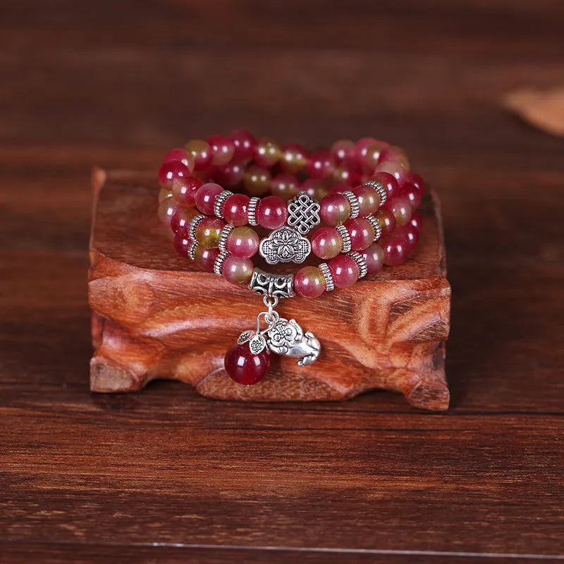 Handmade natural watermelon crystal Chinese knot bracelet in geometric elephant style.