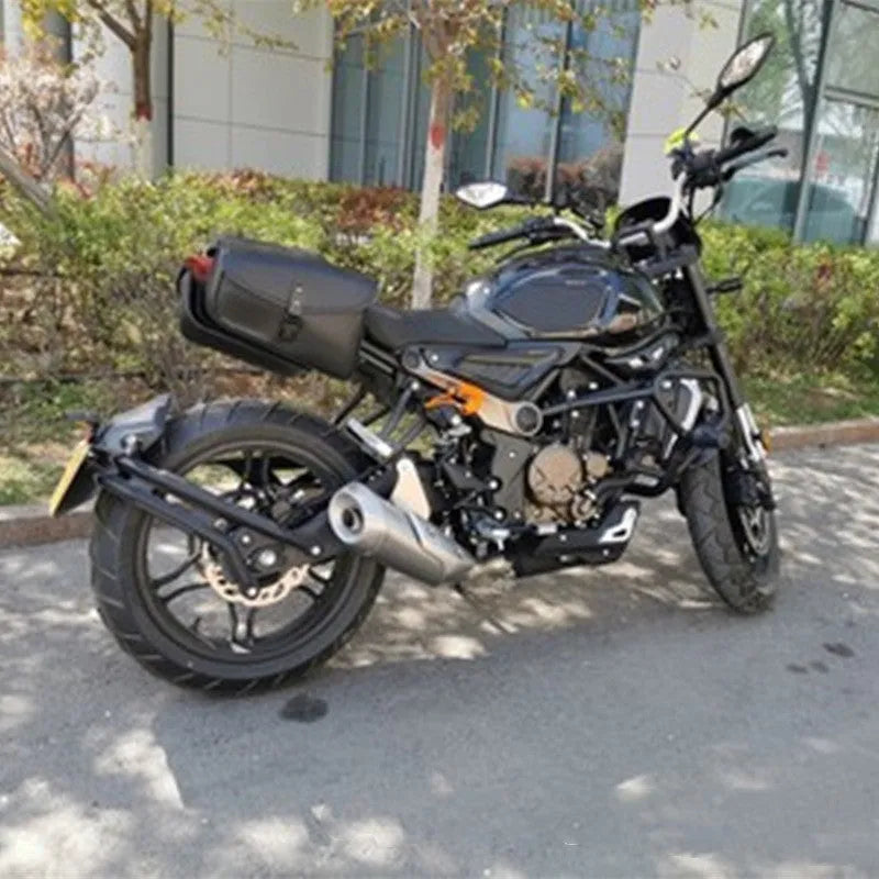 Black PU leather motorcycle swingarm saddlebag mounted on a Harley Sportster rear wheel assembly.