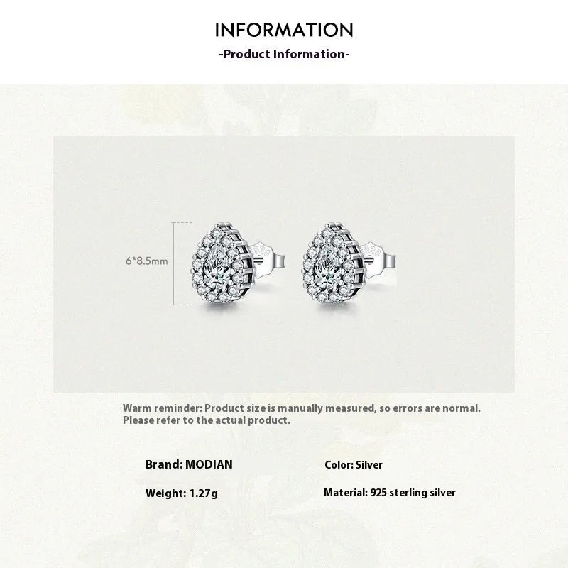 Women's drop shape ear studs in 925 sterling silver with diamond treatment