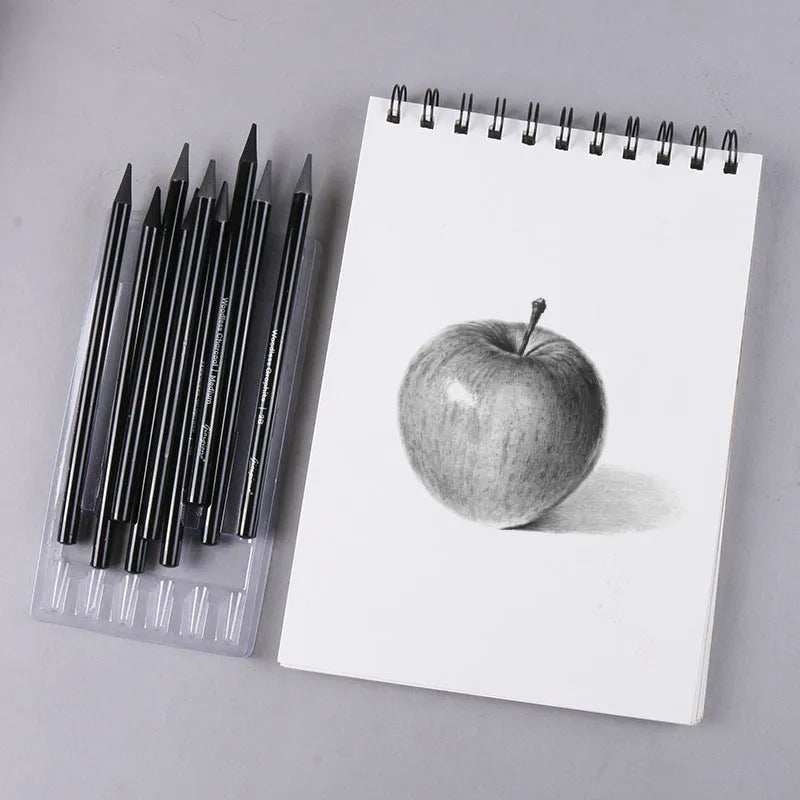 Carbonized pencil set showing six graphite and three carbonized drawing pencils with wooden casings on suction card packaging
