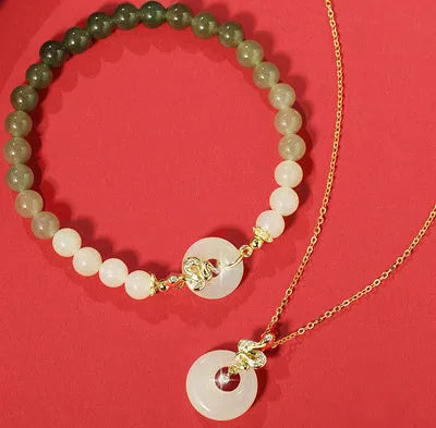 Peach blossom Hetian jade bracelet and necklace set with floral beads in sterling silver mounting