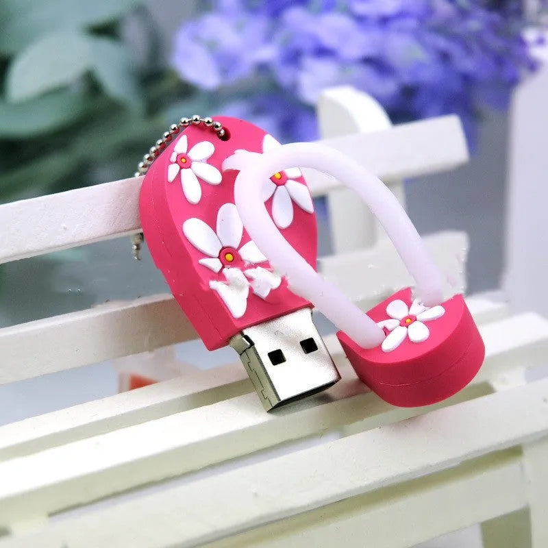 Colourful silicone beach shoe shaped USB flash drive on a white background.