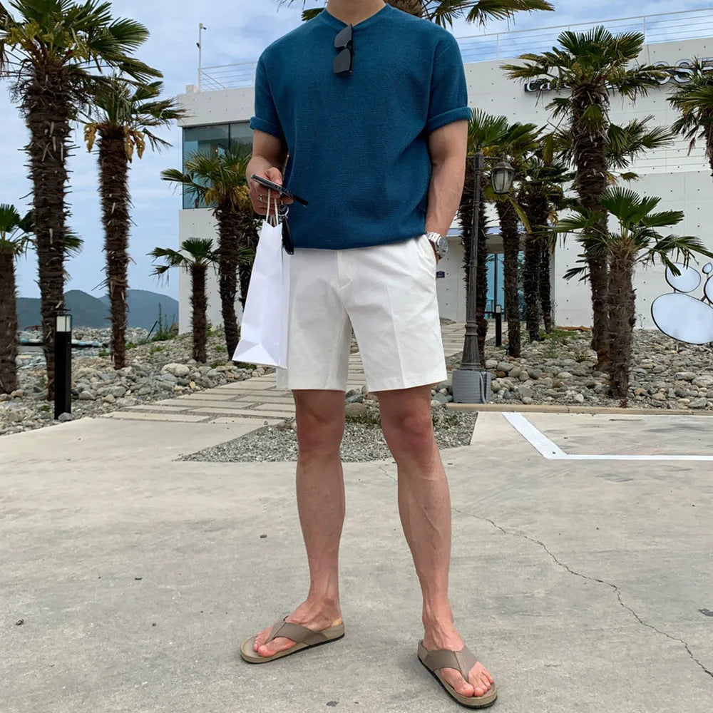 Man wearing loose straight-leg casual shorts in solid khaki colour