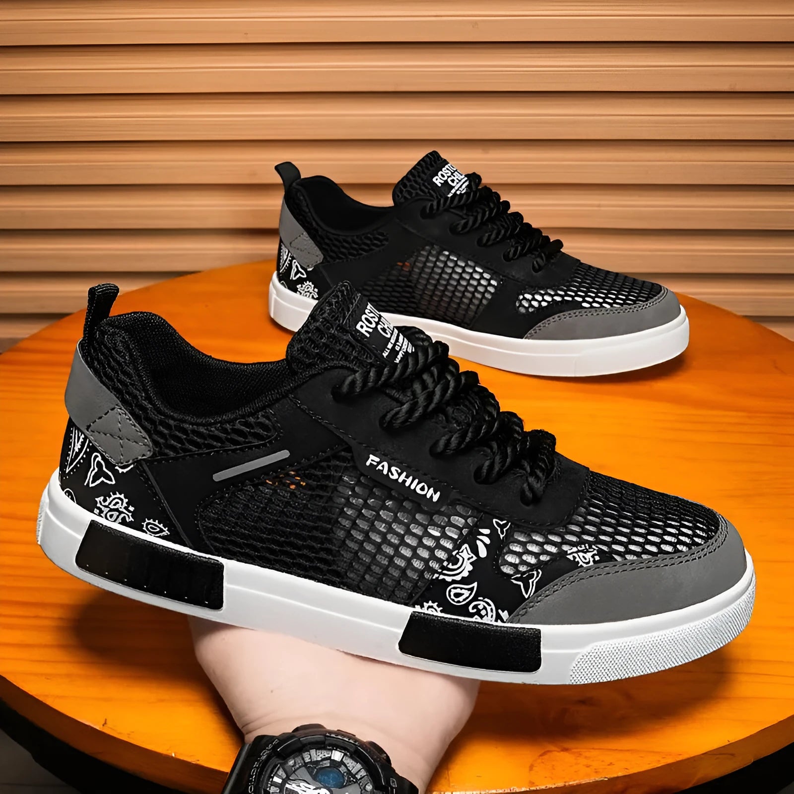 Men's mesh surface breathable shoes in solid colour with flat heel and round toe, shown in black