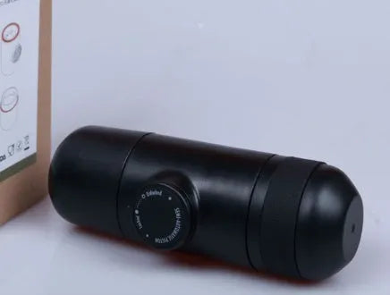 Black portable manual espresso coffee machine with stainless steel parts, shown at 17.5cm height.