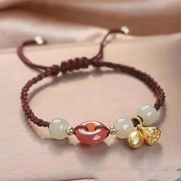 Hetian Jade Peace Buckle Two Shihuan Bracelet with brown leather strap showing constellation detail.